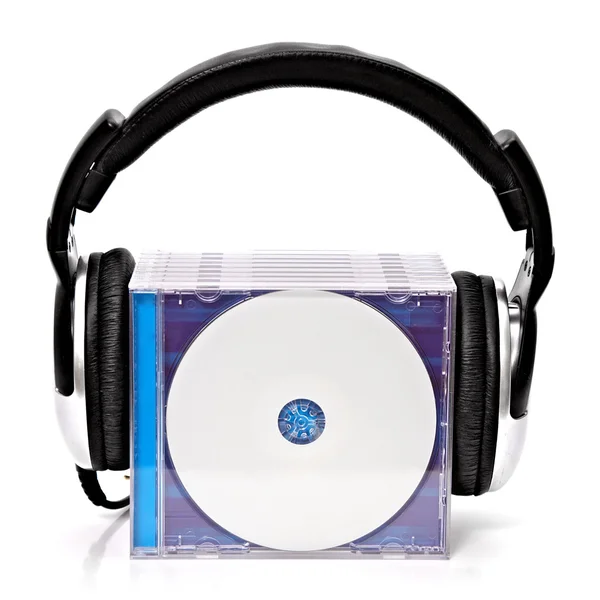 Headphones with stack of CDs — Stock Photo, Image