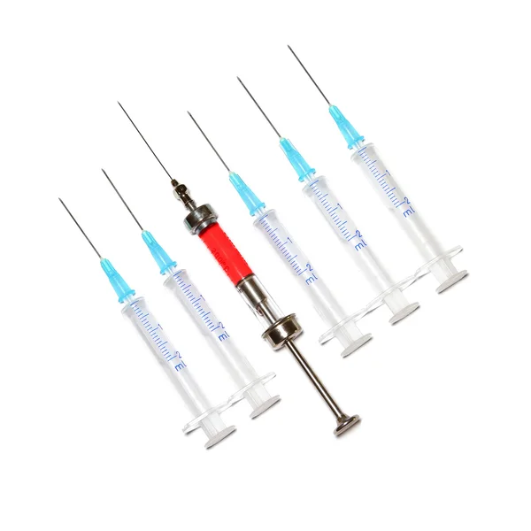 Six syringes in row on white background — Stock Photo, Image