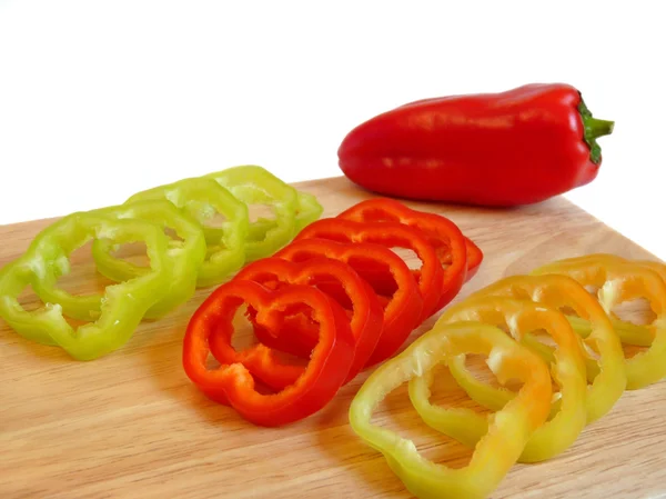 Sweet pepper rings, sliced on a cutting board — Stock Photo, Image