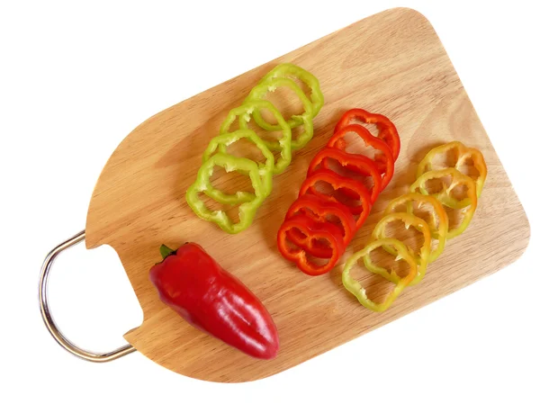 Kroužky papriky, plátky na prkně — Stock fotografie