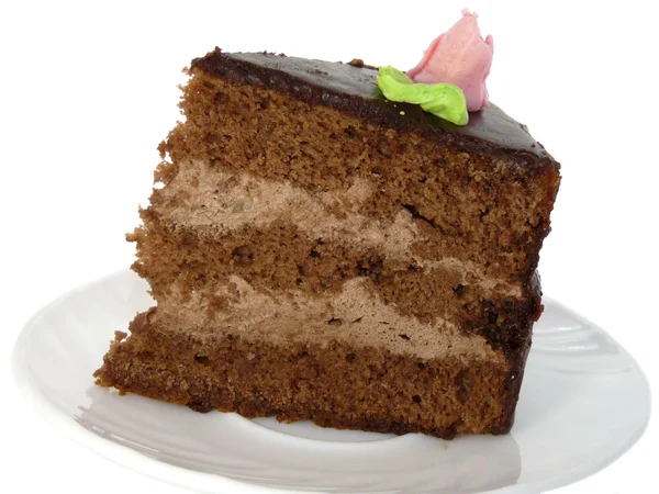 Pedaço de bolo em um prato, isolado em um fundo branco — Fotografia de Stock