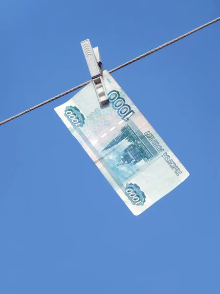 Russian money hanging on the clothesline. Money laundering — Stock Photo, Image
