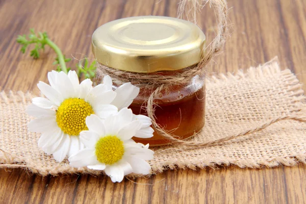 Honey on a wooden table — Stock Photo, Image
