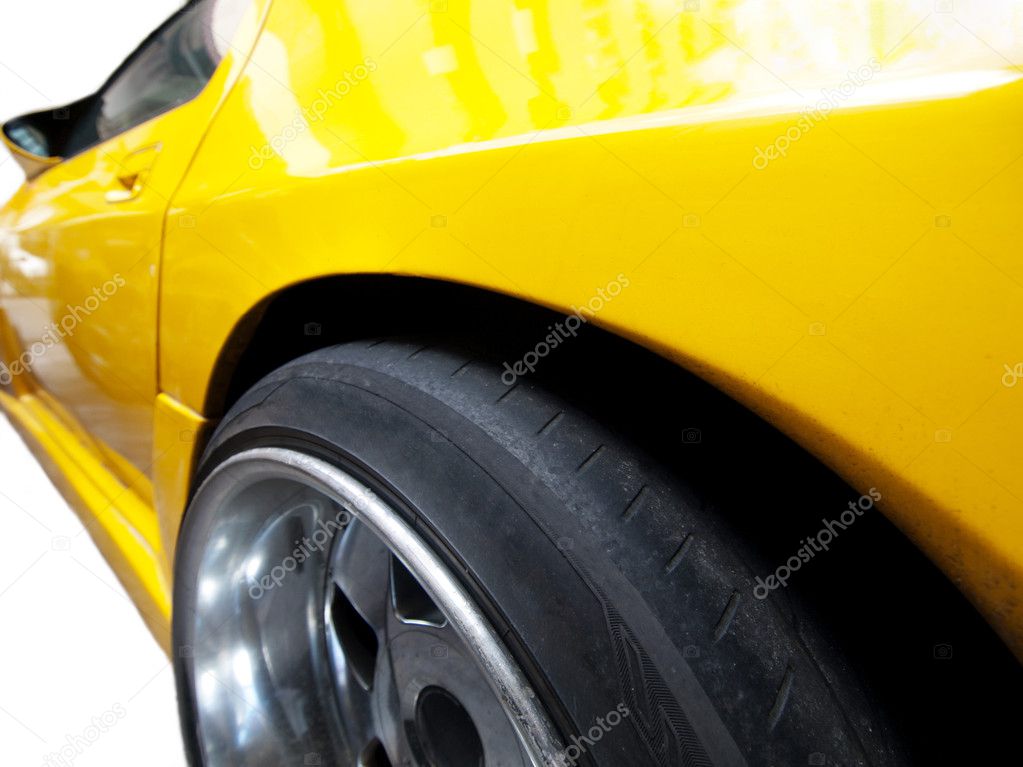 Yellow racing car isolated on pure white background