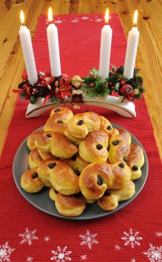 Christmas saffron cakes on the table clipart