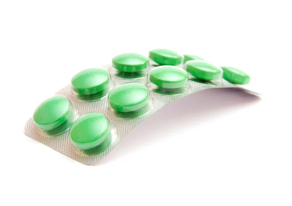 stock image Green pills isolated on white background