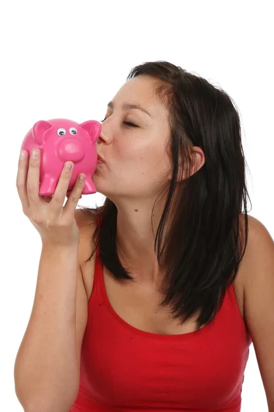 Mooie Brunette Vrouw Zoenen Een Roze Piggy Bank — Stockfoto