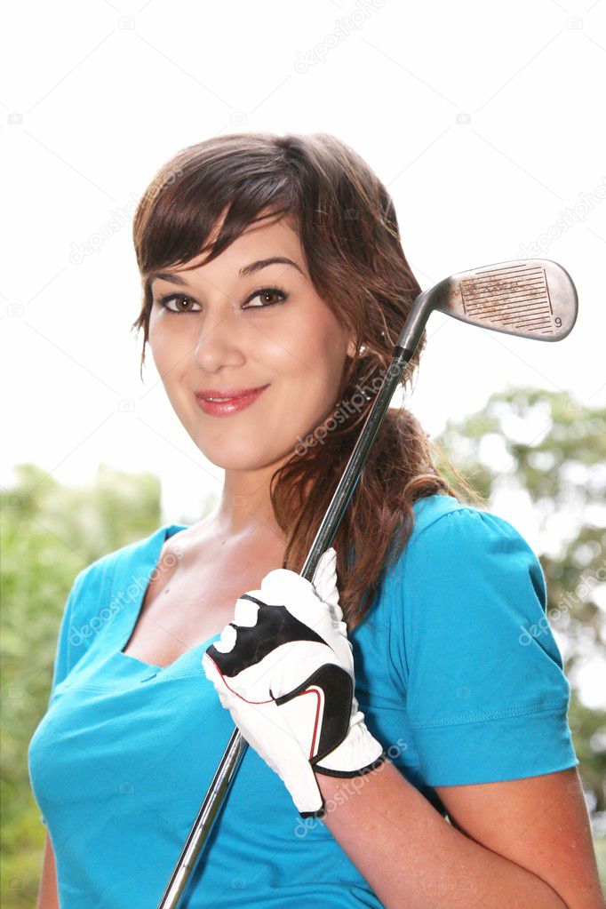 Portrait of a pretty brunette woman golf player