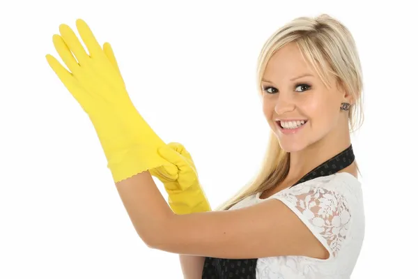 黄色の乳液の手袋でかなりブロンドの女性 — ストック写真