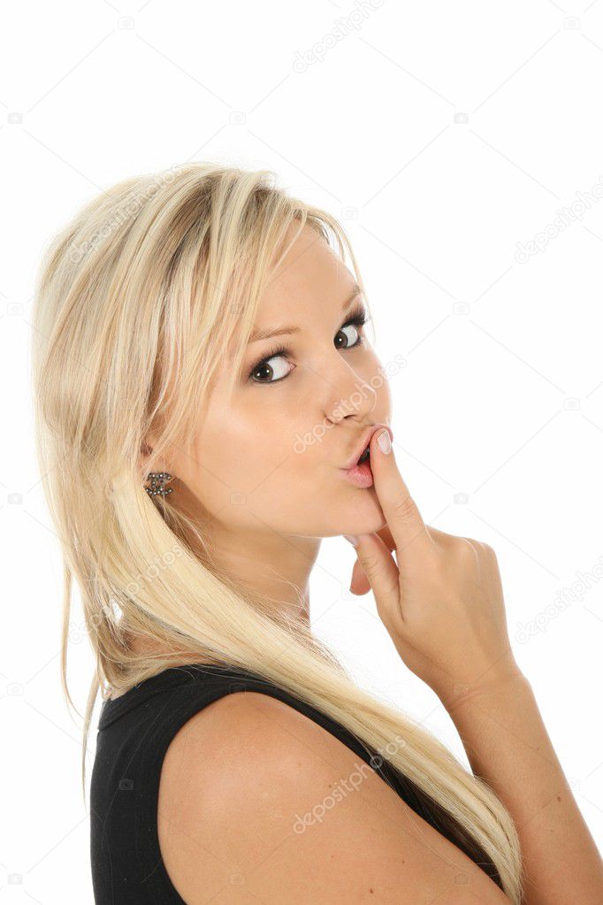 Lovely blonde lady with finger on lips in be quiet sign