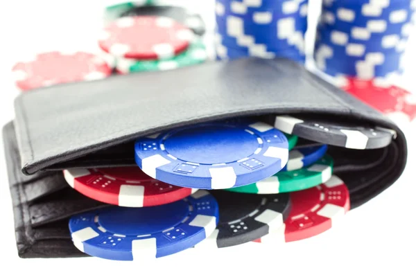 Poker chips in black leather purse — Stock Photo, Image