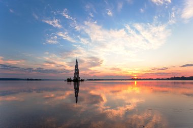 Flooded belltower in Kalyazin at sunrise clipart