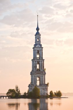 Flooded belltower in Kalyazin at sunrise clipart