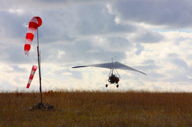 Hang gliding in Crimea taken in summer clipart