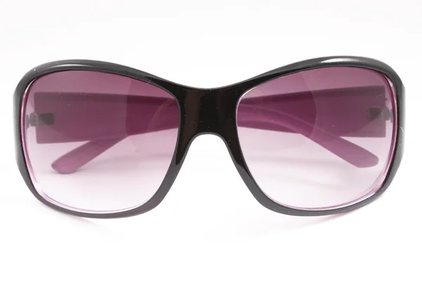 Smukke solbriller til udendørs brug i en solrig dag - Stock-foto