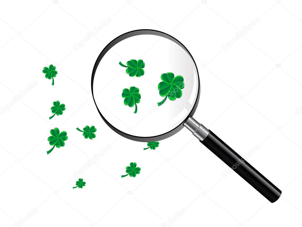 Green clover under magnifying glass