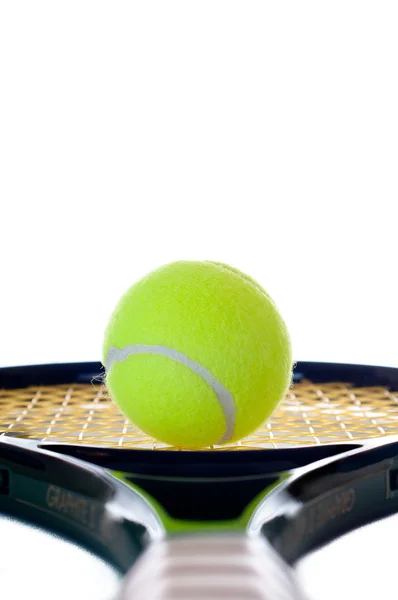 Single tennis ball looking down the handle — Stock Photo, Image