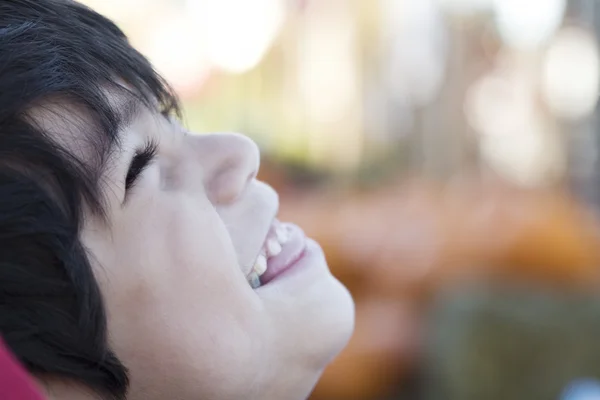 Happy little boy smiling up, profile — Stock Photo, Image
