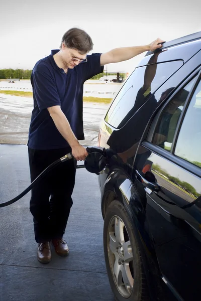 stock image Man pumping gasoline