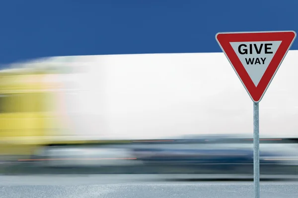 Give Way Yield Road Traffic Sign Motion Blurred Truck Background — Stock Photo, Image