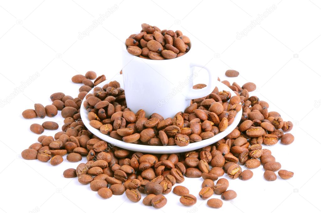 Coffee cup filled with coffee beans