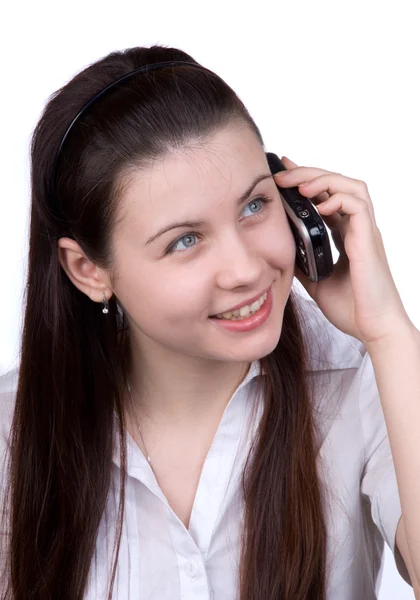 stock image The woman with a cellular telephone on white a background