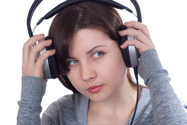 stock image The girl in ear-phones on a white background