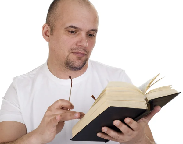 stock image The man reads the bible on a white background