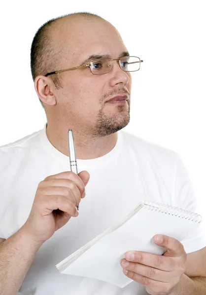 O homem escreve em um caderno Imagem De Stock