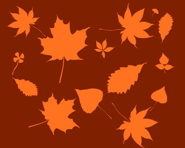 Оранжевые силуэты листьев — стоковый вектор