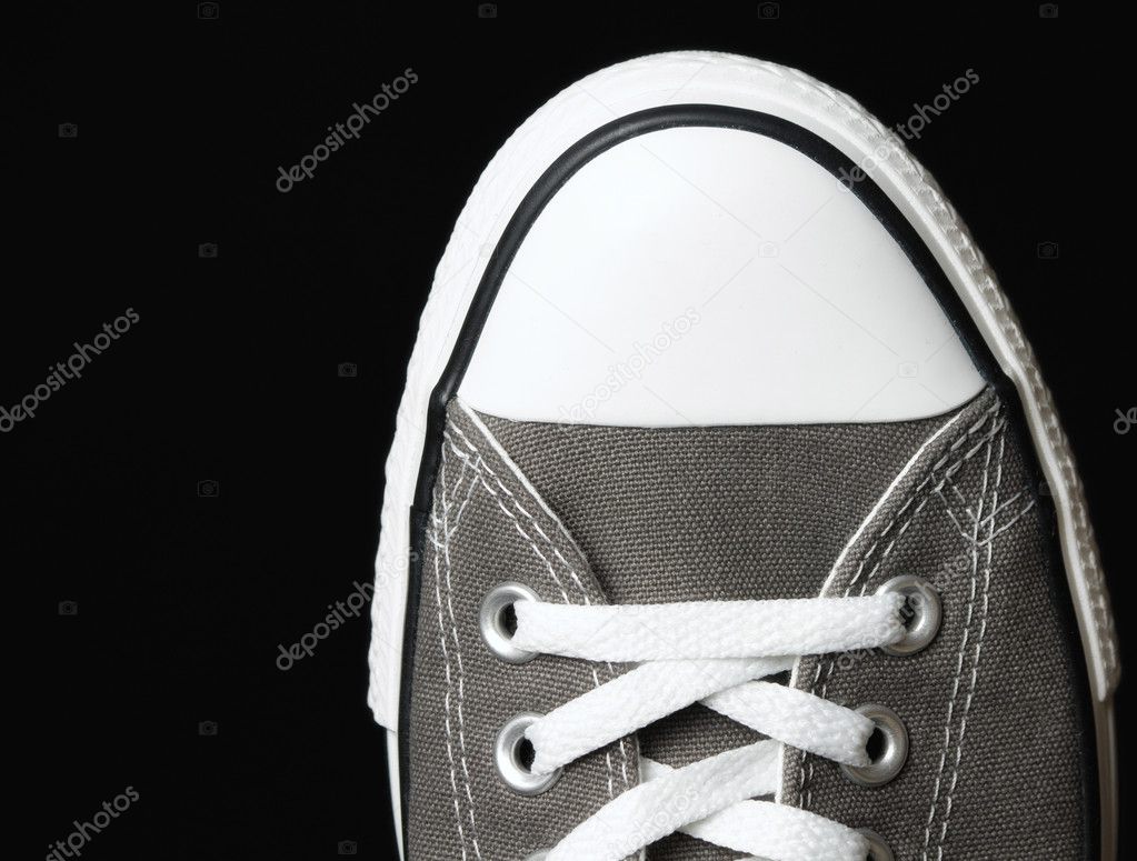 Gray sneakers classic youth footwear at black background — Stock Photo ...