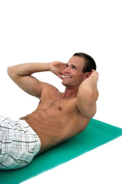 Happy man doing situps — Stock Photo, Image