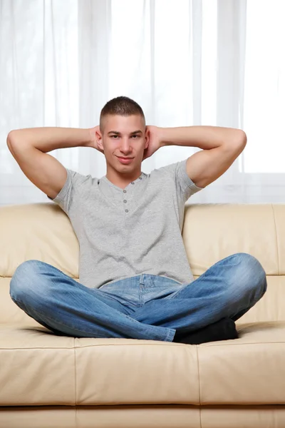 Young handsome man relaxing at home — Stock Photo, Image