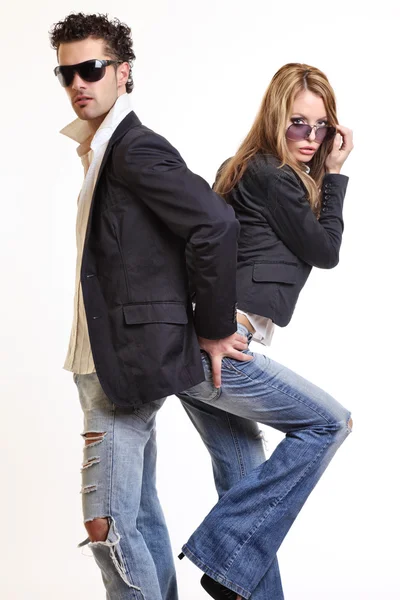 Fashion couple posing in studio — Stock Photo, Image