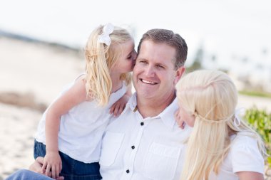 Handsome Dad Getting Kisses from His Cute Daughters clipart