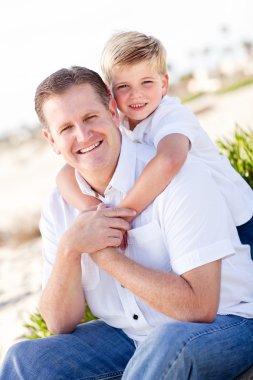 Cute Son with His Handsome Dad Portrait clipart