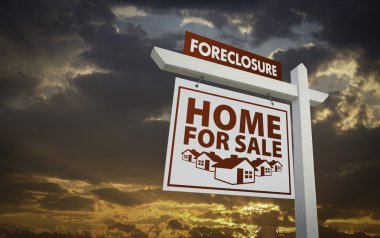 White Foreclosure Home For Sale Real Estate Sign Over Beautiful Clouds and Sunset Sky. clipart