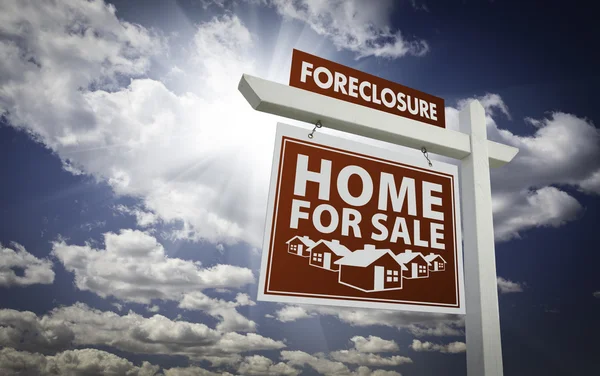 Red Foreclosure Home For Sale Real Estate Sign Over Clouds and S — Stock Photo, Image