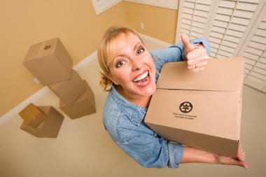 Happy Thumbs Up Woman Moving Boxes clipart