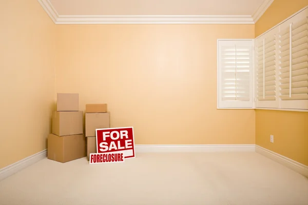 Boxes, Sale and Foreclosure Real Estate Signs in Empty Room — Stock Photo, Image