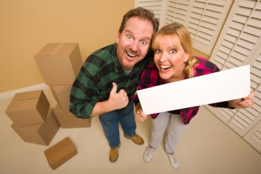 Goofy Goofy Thumbs Up Couple Holding Blank Sign Surrounded by Bo clipart