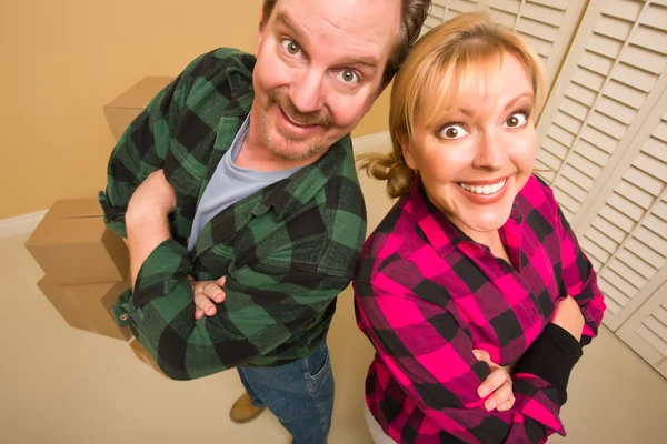 Proud Goofy Couple and Moving Boxes in Empty Room — Stock Photo, Image