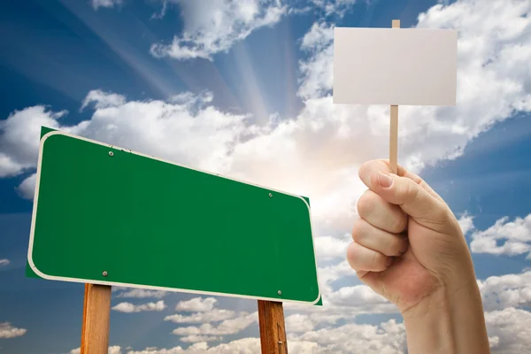Blank Green Road Sign and Man Holding Poster on Stick — Stock Photo, Image