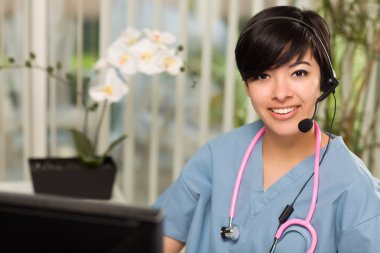 Attractive Multi-ethnic Woman Wearing Headset, Scrubs and Stetho clipart