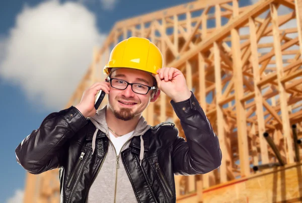 Young Construction Worker on Cell Phone In Front of House — Stock Photo, Image