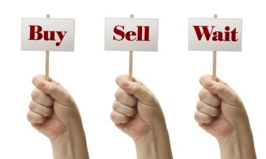 Three Signs In Fists Saying Buy, Sell and Wait clipart