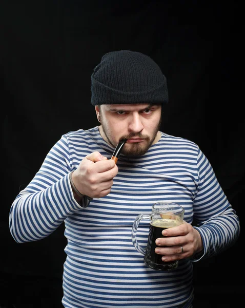 Drunk sailor man with mug of dark beer — Stock Photo, Image