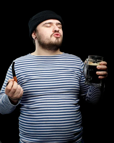 Drunk sailor man with mug of dark beer — Stock Photo, Image