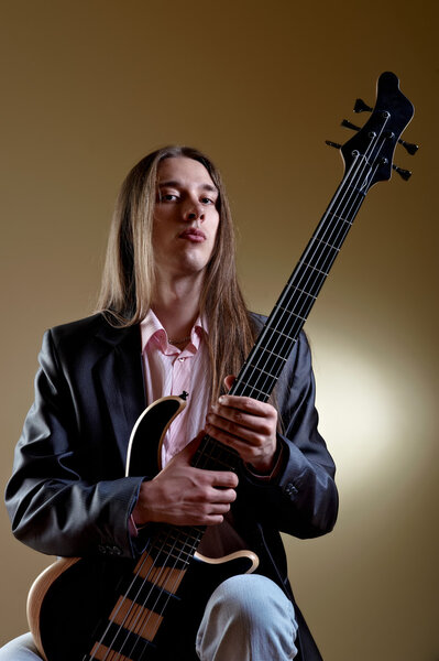 Portrait of musician with bass guitar