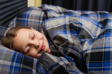 Cute little girl. Sleeping in bed. clipart